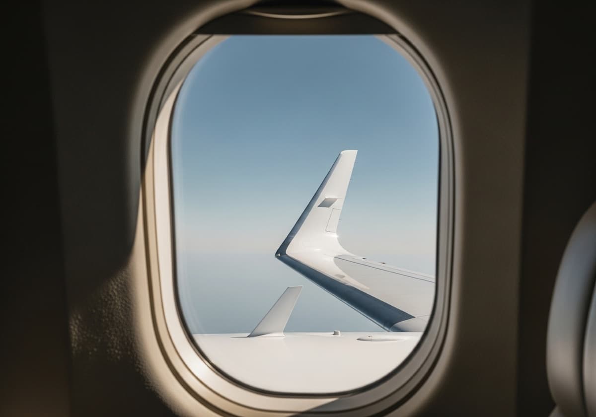 View of a winglet through a business jet cabin window